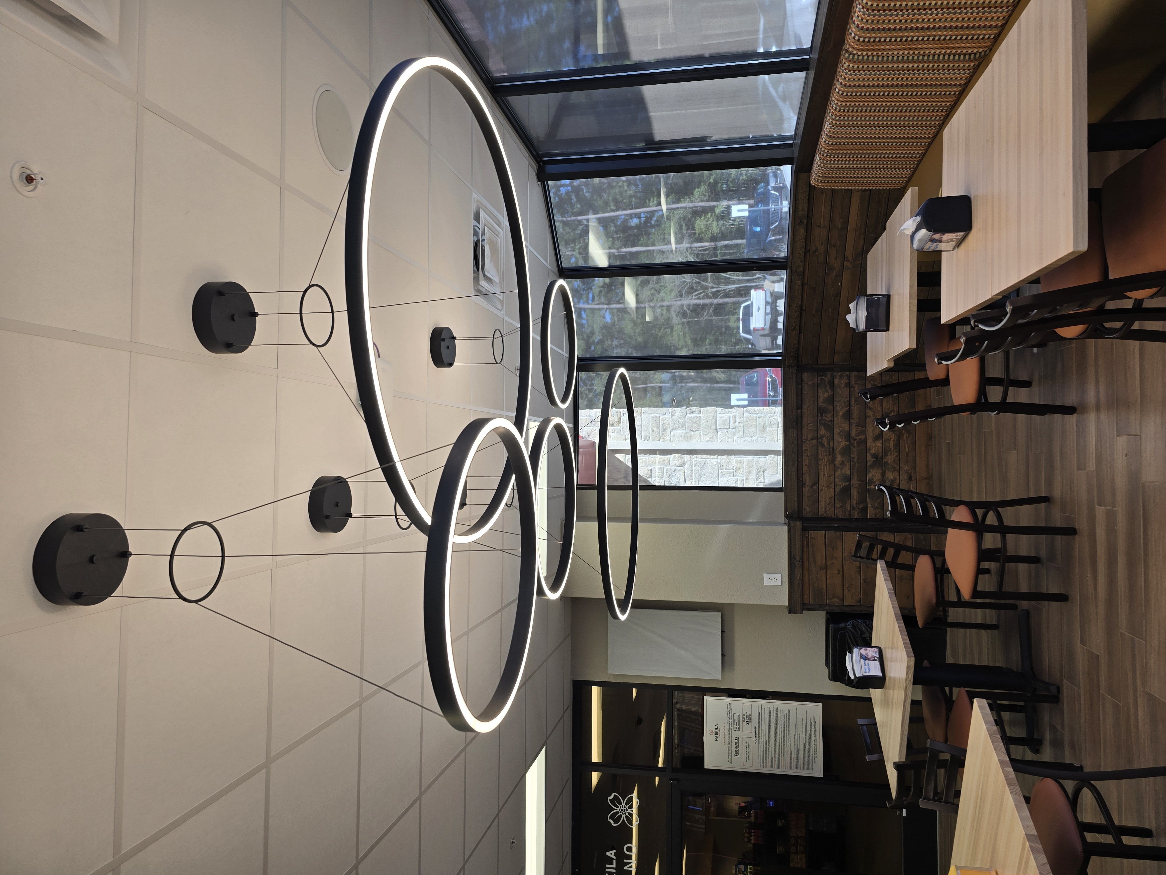 Restaurant seating area with halo ring lights